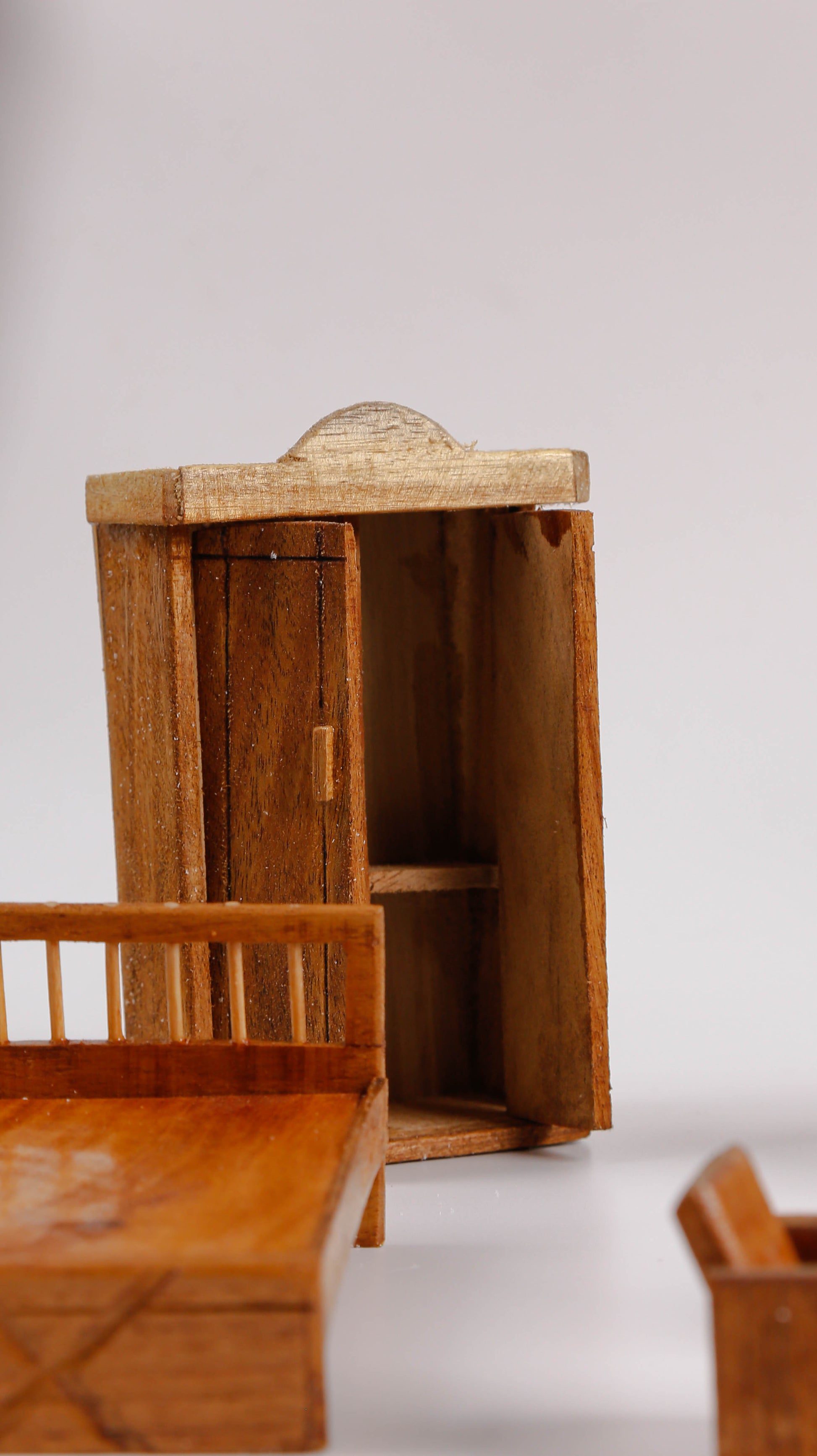 miniature wooden temple and bed