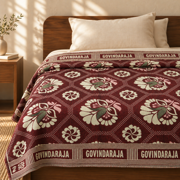 G. Raja Chennimalai Bedsheet Maroon Heritage Bloom — cotton top cover on a bed