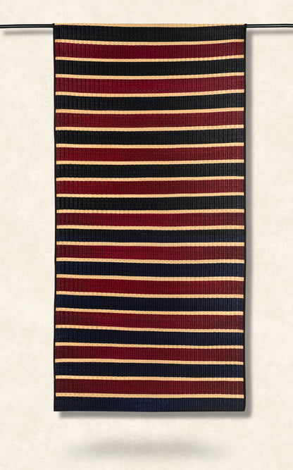 Striped fabric with red, navy, and beige stripes on a white background