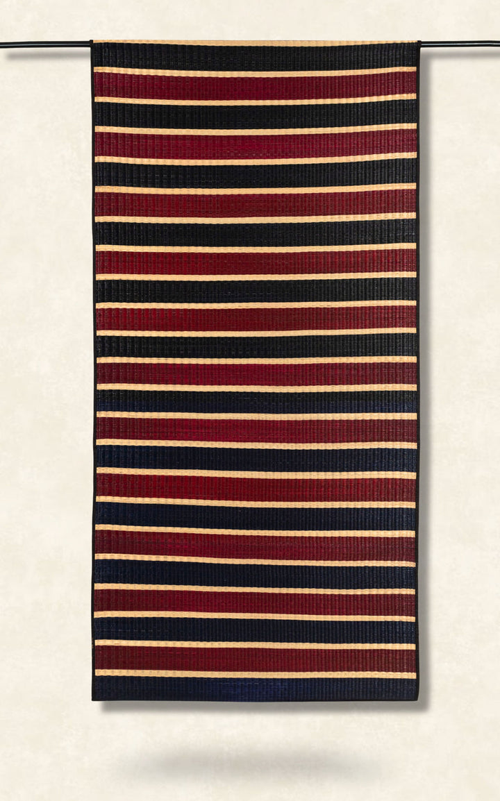 Striped fabric with red, navy, and beige stripes on a white background