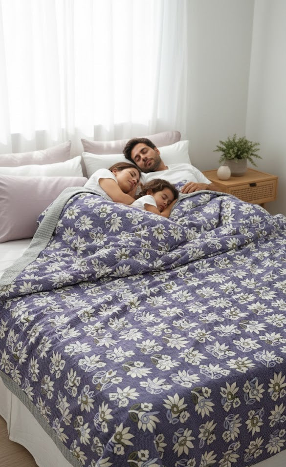 Family lying in bed under a Jacquard Double Cot Bedsheet (Floral wine)