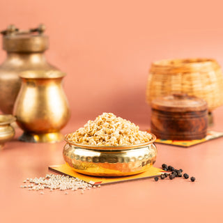 A bowl of pearl millet spicy snacks on a table with traditional Indian pottery in the background.