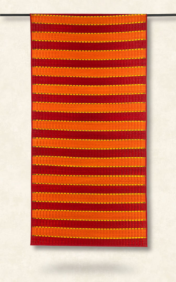 Red and orange striped fabric on a white background