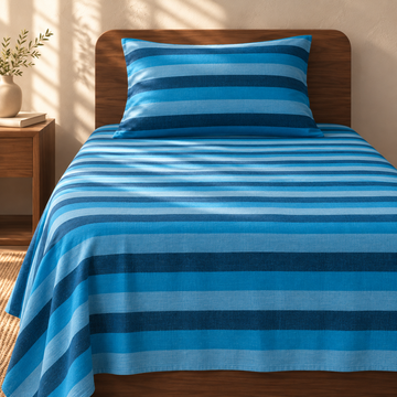 Chennimalai Single Cot Bedspread Ocean Blue Striped with matching pillow covers, square bedroom photograph