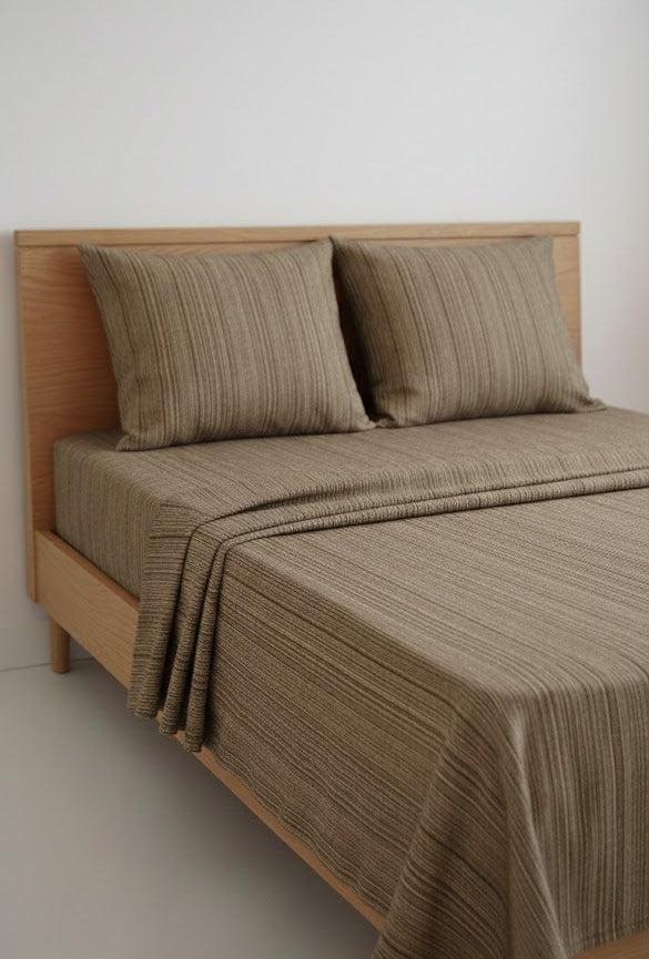 Bed with Single Cot Chennimalai Bedspread with Coffee Brown Texture and pillows against a white wall