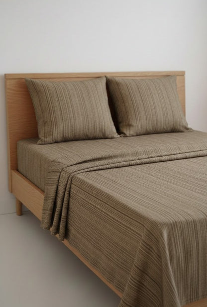 Bed with Single Cot Chennimalai Bedspread with Coffee Brown Texture and pillows against a white wall