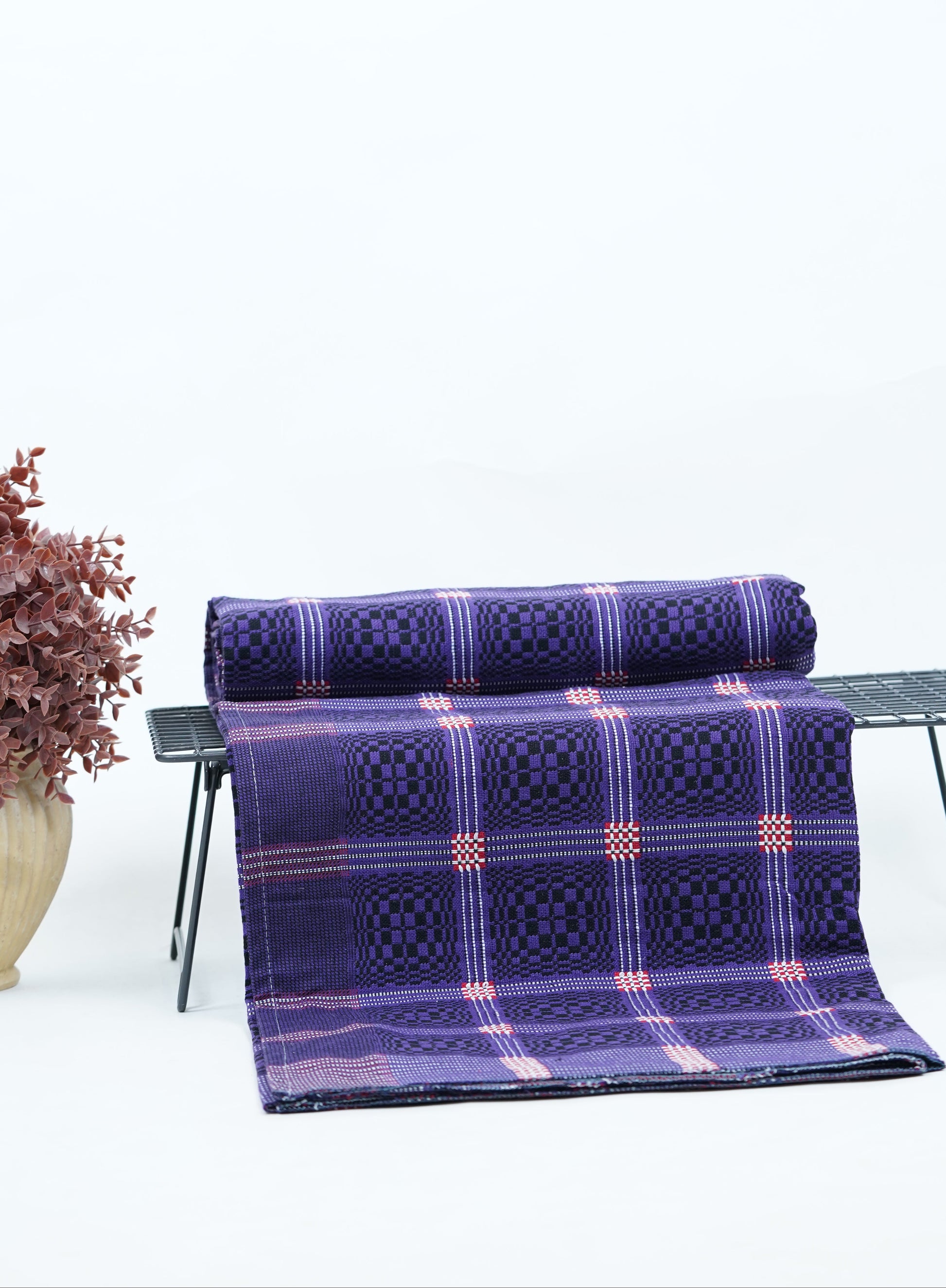Purple Nadhiya Chennimalai Bedsheet on a table with a white background
