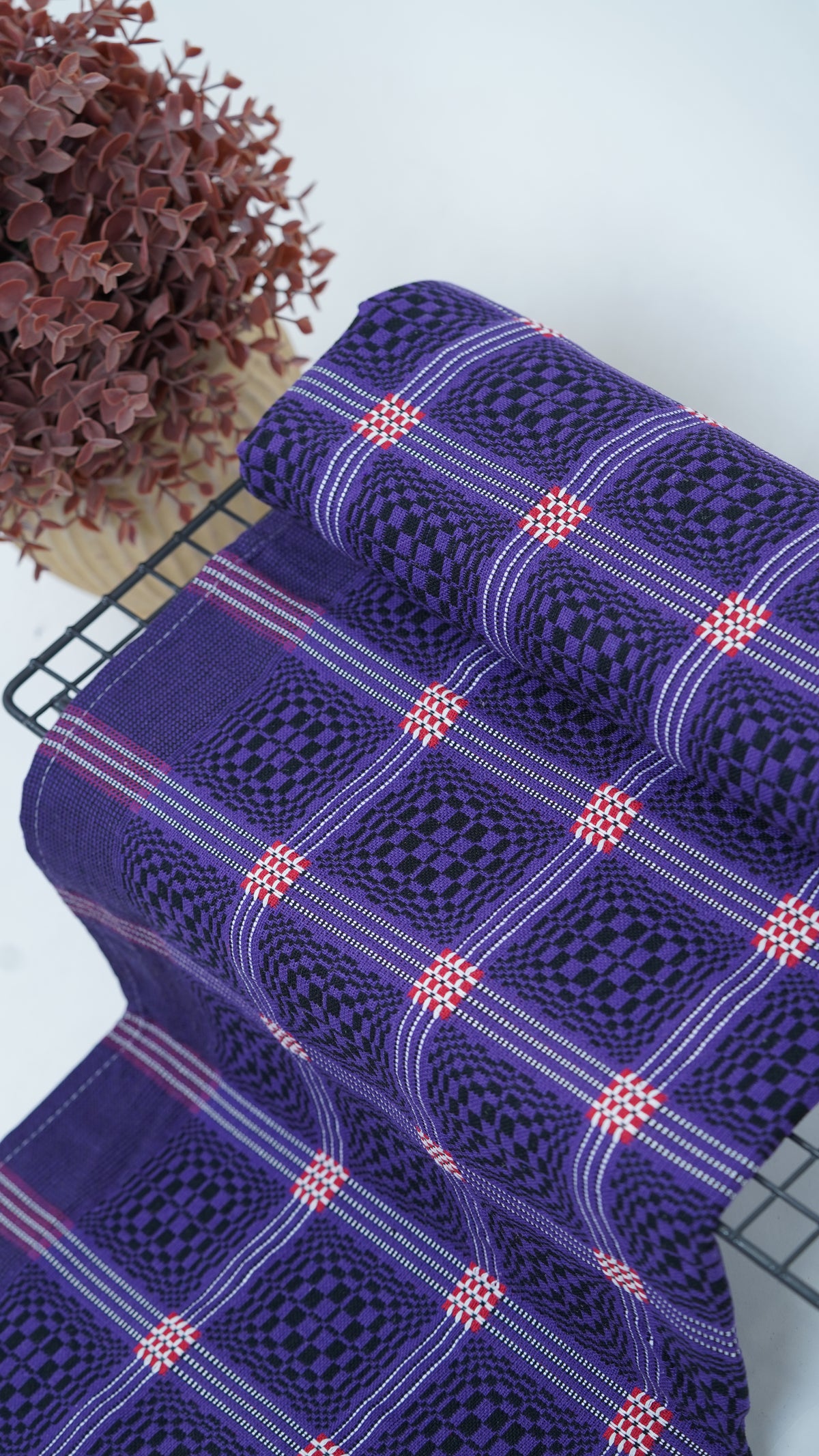 Purple Nadhiya Chennimalai Bedsheet on a table with a white background