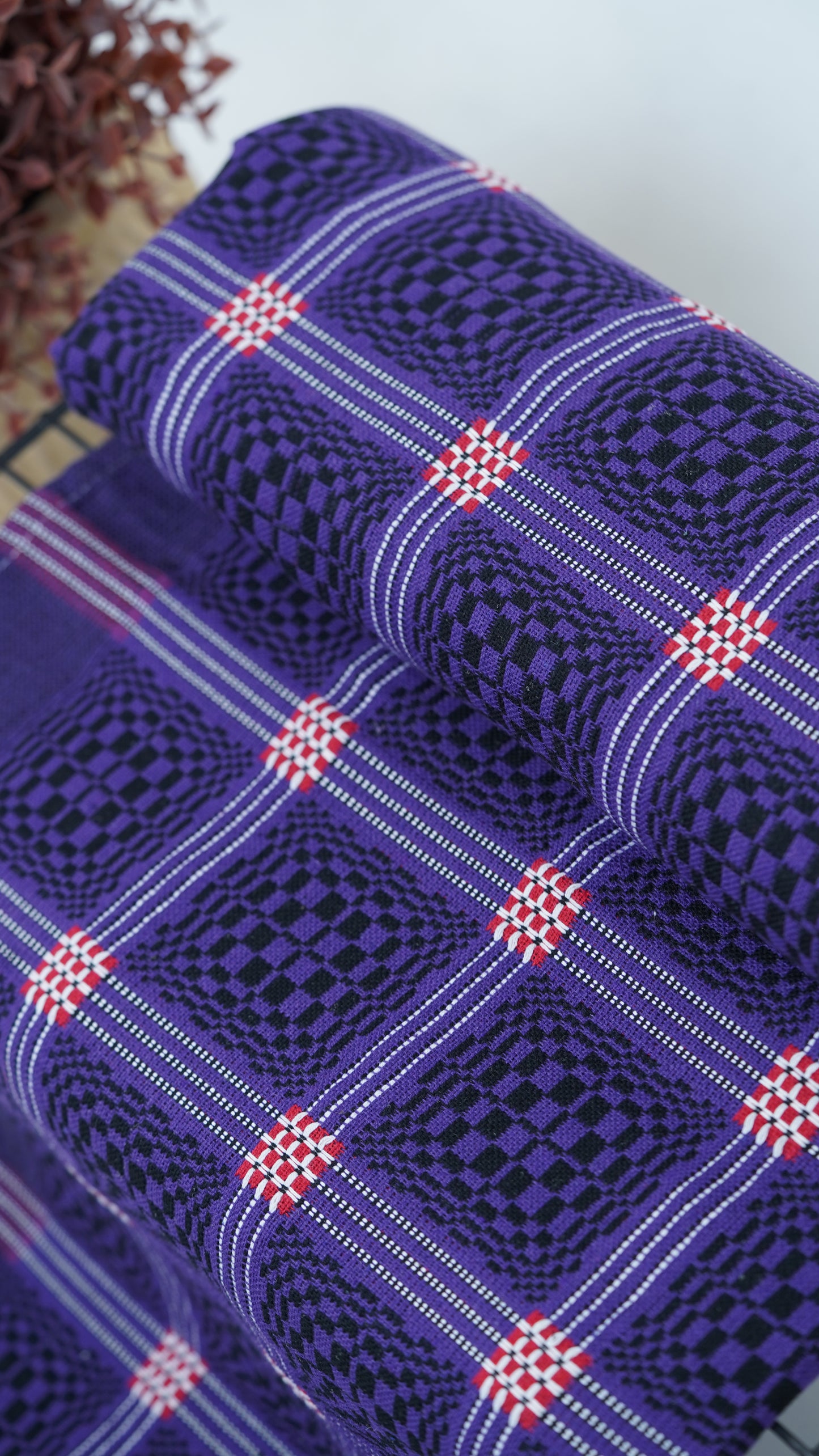 Purple Nadhiya Chennimalai Bedsheet on a table with a white background