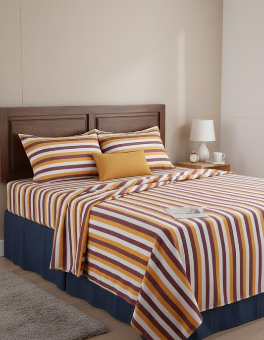Chennimalai Double Cot Bedsheet Mustard and Maroon with pillows in a bedroom setting