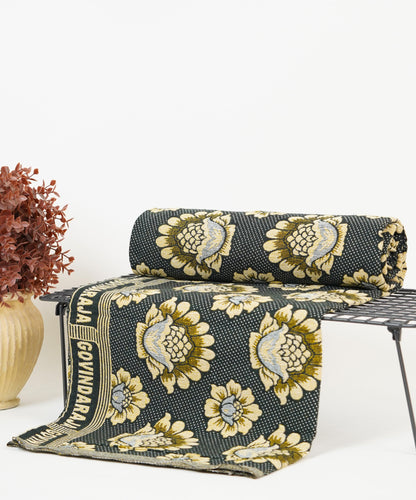 Raja Chennimalai Olive Petal Bed Sheet with golden floral patterns on a white surface,