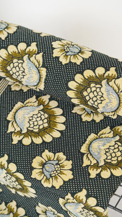 Floral patterned fabric with yellow and beige flowers
