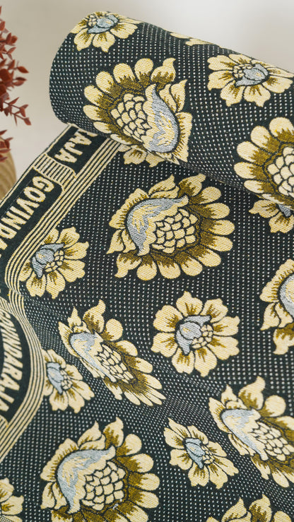 Floral patterned fabric with a visible brand name on a textured background