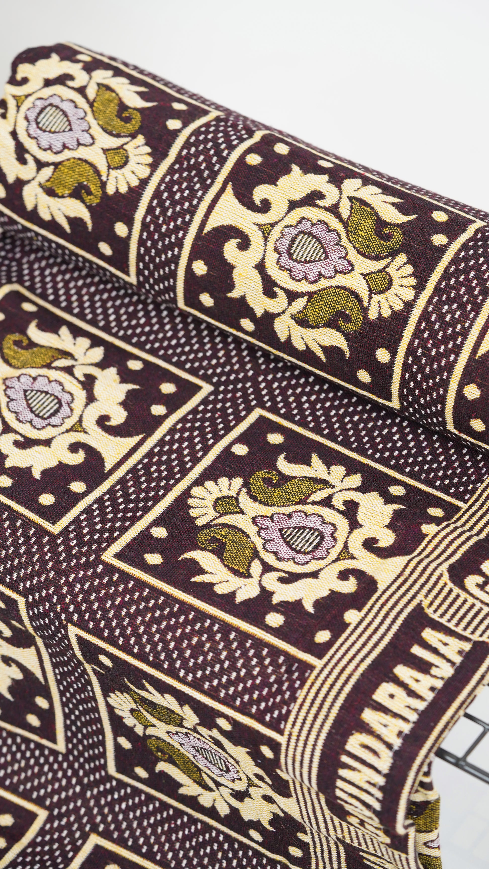 Ivory Bloom G. Raja Chennimalai Bed Sheet with intricate patterns and text on a dark background