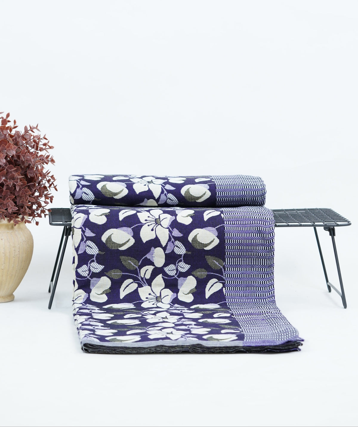 Floral-patterned Premium Handloom double cot Chennimalai bedsheet and towel set on a table with a white background