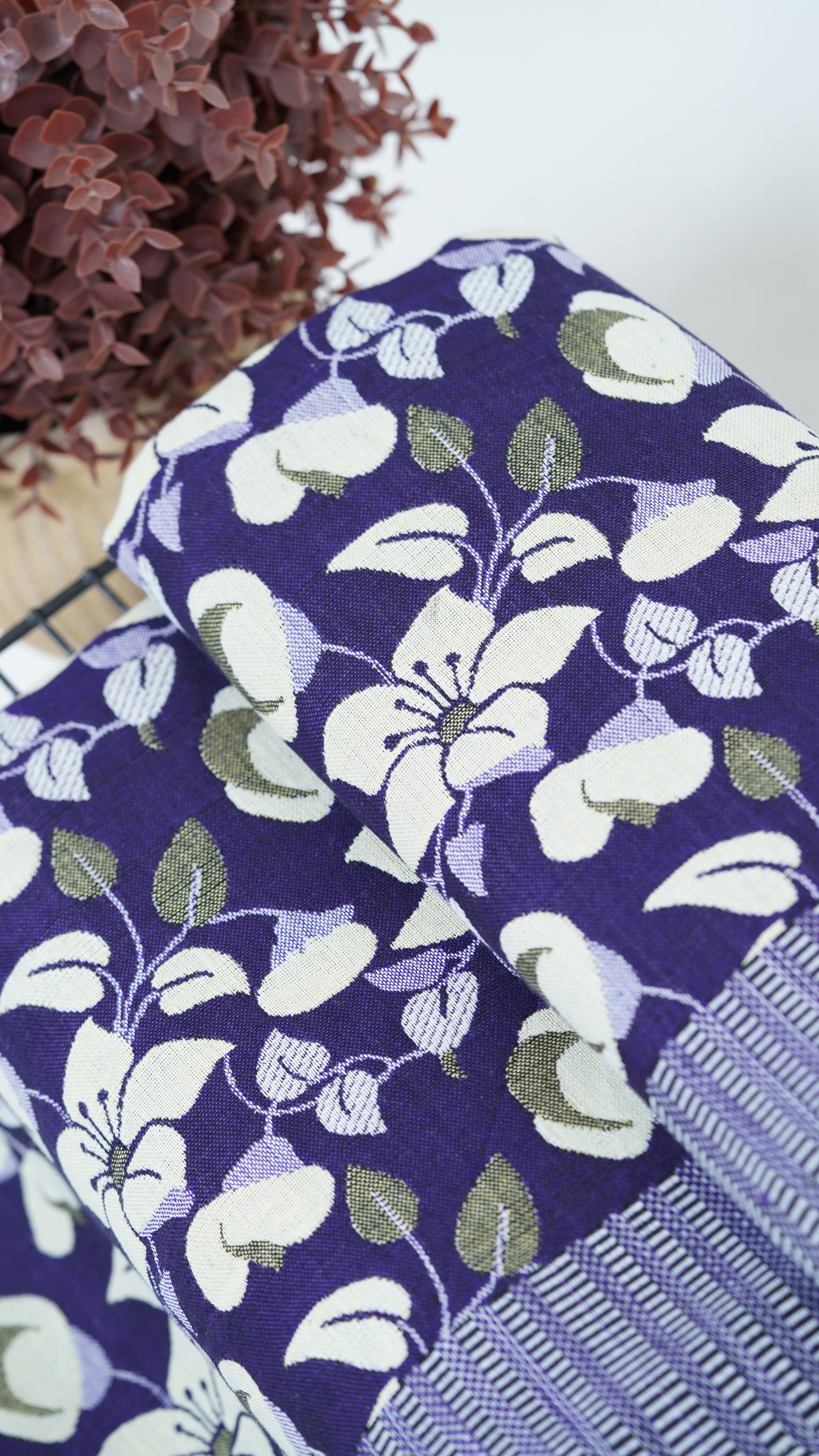 Floral-patterned Premium Handloom double cot Chennimalai bedsheet with white flowers on a white background