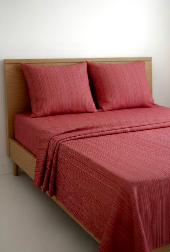 Chennimalai Single Cot Bedspread Rustic Rose Textured and pillows on a wooden bed against a white wall