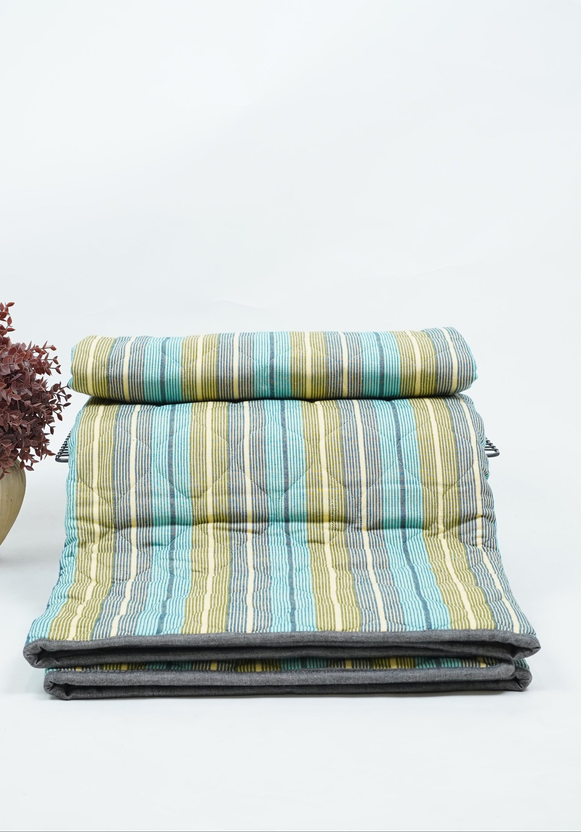 Premium Handloom Single Cot Chennimalai Quilt with green and blue pattern on a white background