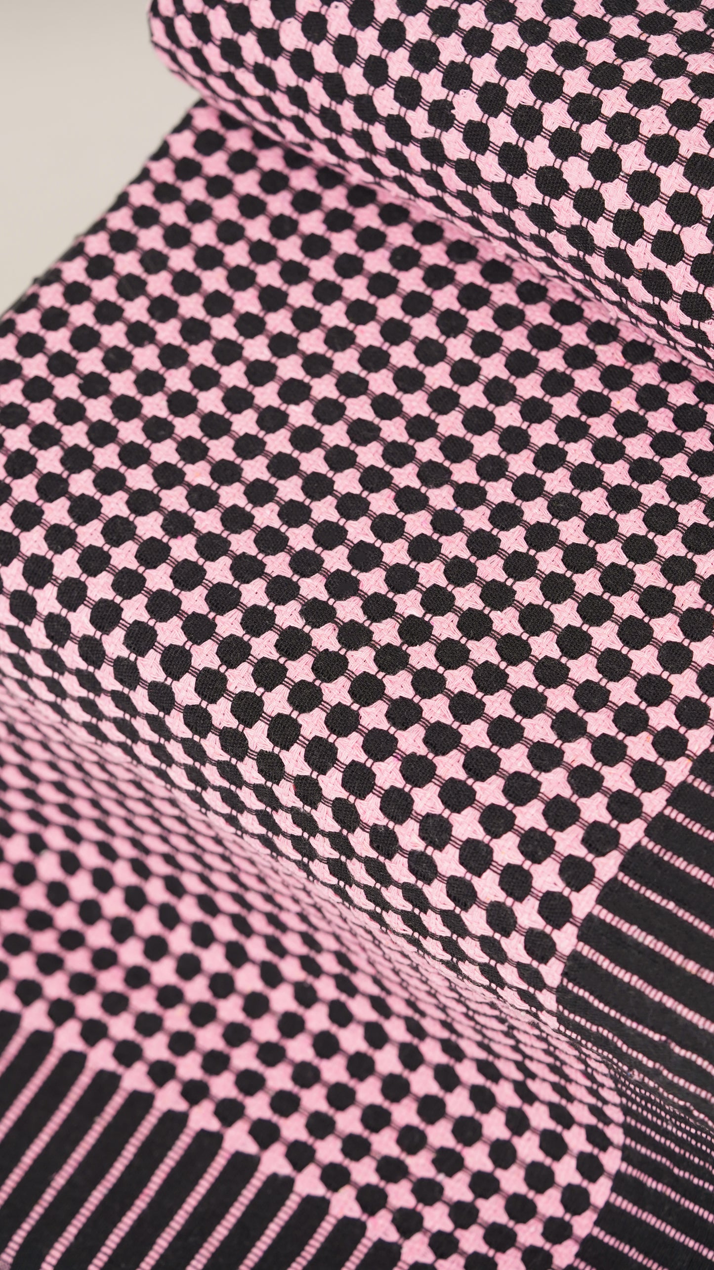 Close-up of pink and black checkered fabric