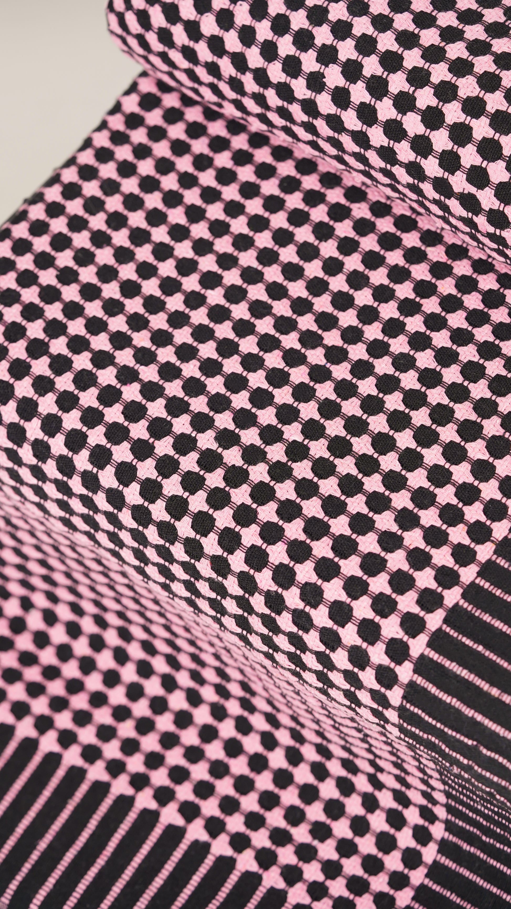 Close-up of pink and black checkered fabric